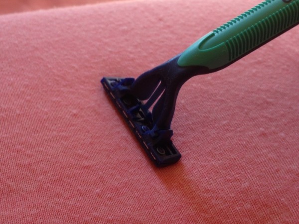 Shaving pills with a razor